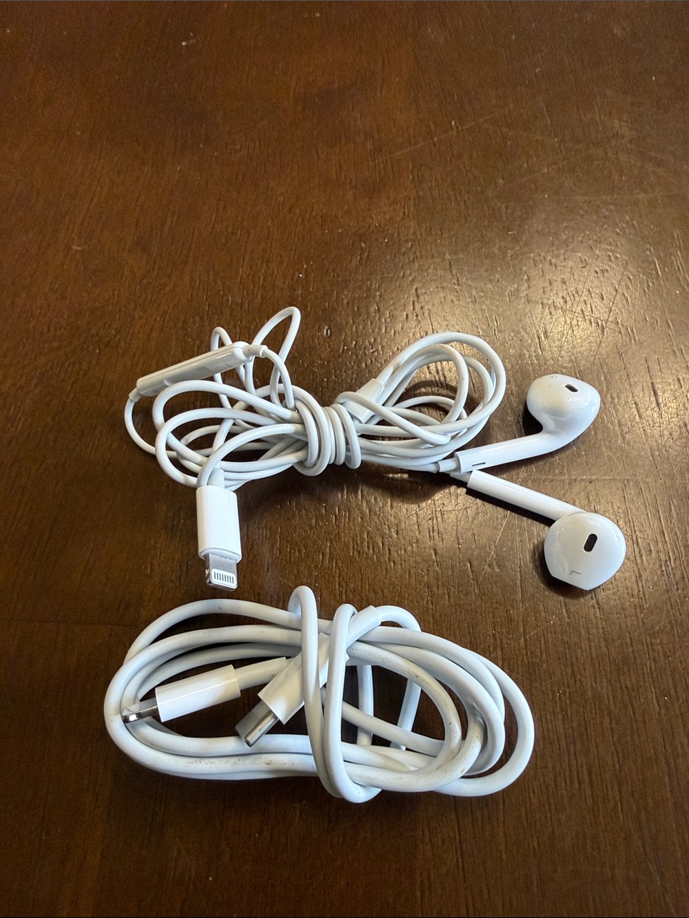 Apple lightening charger and headset.